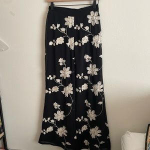 black embroidered floral flare pants